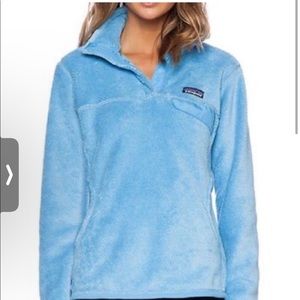 Light blue women’s Patagonia retool snap pullover